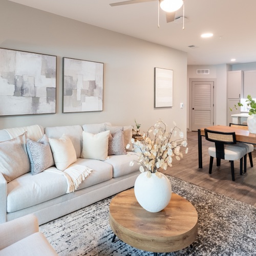 living room with coffee table white couch and table with chairs