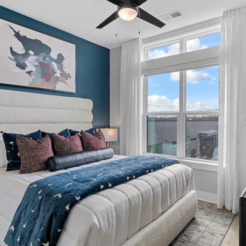 Bedroom with natural lighting and high ceilings