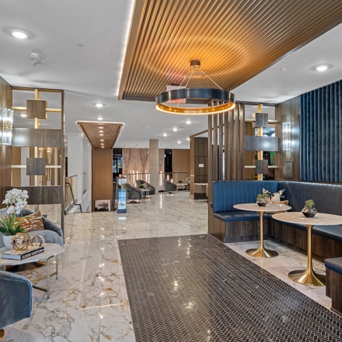 a dining or reading area with tables and chairs